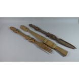 A Collection of Three Carved Wooden African Staffs in the Form of Trident, Spoon and Mask with Shell