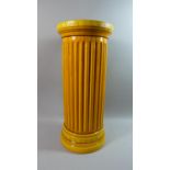 A Large Orange Glazed Ribbed Cylindrical Stoneware Stick Stand by Burmantofts, Impressed Mark to