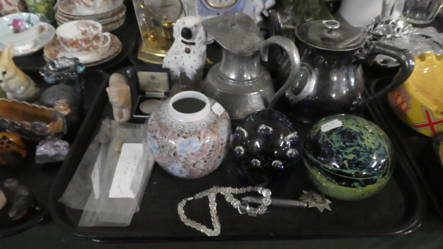 A Tray of Sundries to Include Large Glass Paperweights, Pewter Jug and Silver Plated Teapot,