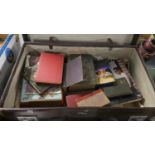 A Vintage Leather Suitcase Monogrammed GM Containing Vintage Books