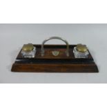 An Edwardian Silver Plate Mounted Desk Top Ink and Pen Stand in Oak with Two Glass Bottles, 25.