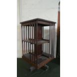 An Edwardian Mahogany Revolving Bookcase, in need of some Attention 49cms Square