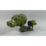 A Carved African Green Stone Figure Group depicting Hippo and Calf, Calf detached from Base, 35cms