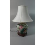 An Oriental Ceramic Table Lamp and Shade Decorated with Flowers