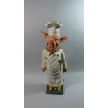 A Large Heavy Cast Iron Novelty Door Stop in the Form of a Pig Dressed as Chef, 59cms High