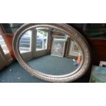 A Large Gilt Framed Oval Wall Mirror, 105cm Wide