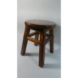 A Modern Circular Topped Stool with Leather Strapwork Decoration, 30cms Diameter, 39cms High