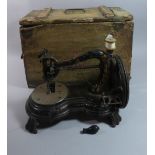 An Early Sewing Machine in Wooden Box