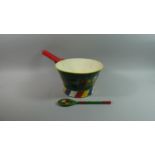 A Hand Painted Barge Ware Saucepan Together with a Wooden Spoon