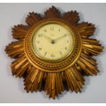 A Smiths Sectric Wall Hanging Starburst Clock. 30cm Diameter