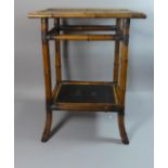 An Oriental Bamboo Framed Two Tier Rectangular Topped Occasional Table, The Lacquered Top