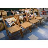 A Set of Four Vintage Folding Chairs