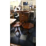 A Set of Three Inlaid Italian Tripod Wine Tables