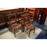 A Set of Seven Elm Seated Chapel Chairs