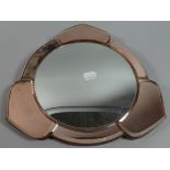 A Shaped Circular Mirror with Amber Glass Frame, 27cm Diameter