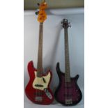 Two Electric Bass Guitars, Both in Need of Attention