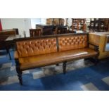 A Large Hardwood Framed Brown Leather Upholstered Pub Settle with Buttoned Back Panels, 2.2m Long