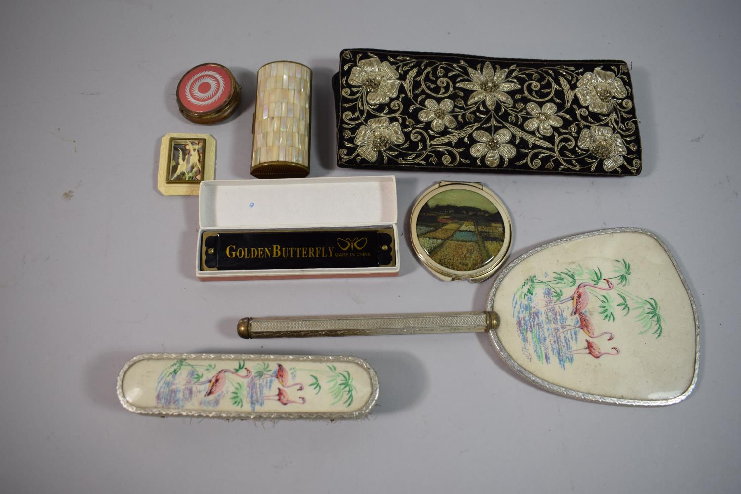 A Collection of Curios to Include Dressing Table Brush and Mirror, Chinese Mouth Organ,