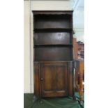 An Oak Bookcase with Panelled Door to Base Cupboard and Two Shelves Over, 76cm Wide