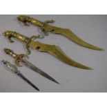 A Pair of Reproduction Brass Wall Hanging Daggers and Two Small Examples