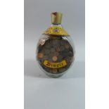 A Vintage Dimple Scotch Whiskey Bottle Containing Substantial Number of Decimal Half Pennies