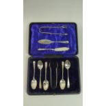 A Collection of Five Silver Teaspoons and Matching Sugar Bow Together with Two Silver Butter