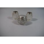 A Collection of Three Cut Glass Silver Topped Dressing Table Pots