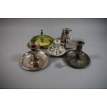 A Collection of Four Silver Plated and One Enamelled Bed Chamber Sticks