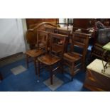 A Set of Five Chapel Chairs with Prayer Book Shelves