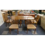 A 1970's Drop Leaf Dining Table and Six Chairs