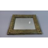 A Hand Beaten Arts and Crafts Rectangular Brass Framed Mirror, 33cm Wide