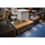 A Rectangular Chip Board Coffee Table with Shelves and Two Drawers, 110cm Wide Together with a White