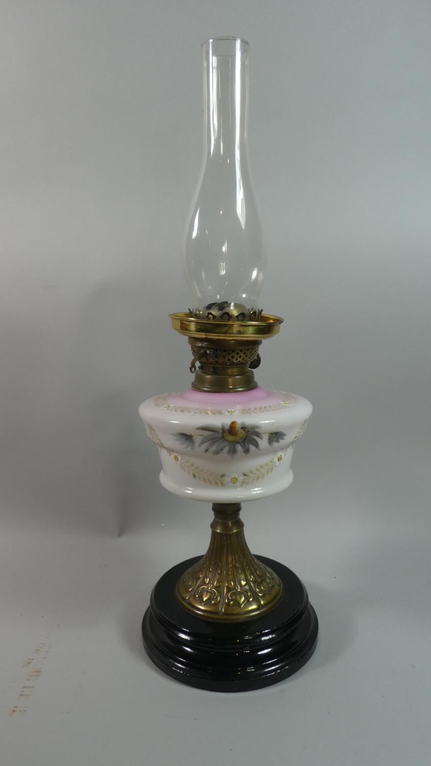 A Late Victorian Brass Mounted Oil Lamp with Painted Opaque Glass Reservoir and Plain Chimney, Brass