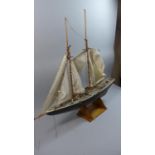 A Wooden Model of a Two Masted Schooner on Stand, 80cm Long