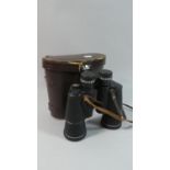 A Pair of Leather Cased Prinz 10x50 Binoculars