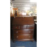 A Stag Mahogany Fall Front Bureau with Three Small Drawers Over Two Long Drawers, 75.5cm Wide