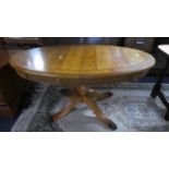 A Modern Yew Wood Oval Coffee Table, 94cm Wide
