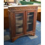 An Edwardian Oak Carved Glazed Bookcase, 91cm Wide