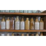 A Collection of Nine Stoneware Brewers Bottles with Impressed Marks for Kinmond, Livesey, Dutton,