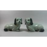A Pair of Glazed Oriental Studies of Reclining Pekinese Dogs, 30cm Long