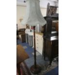 An Edwardian Oak Standard Lamp and Shade