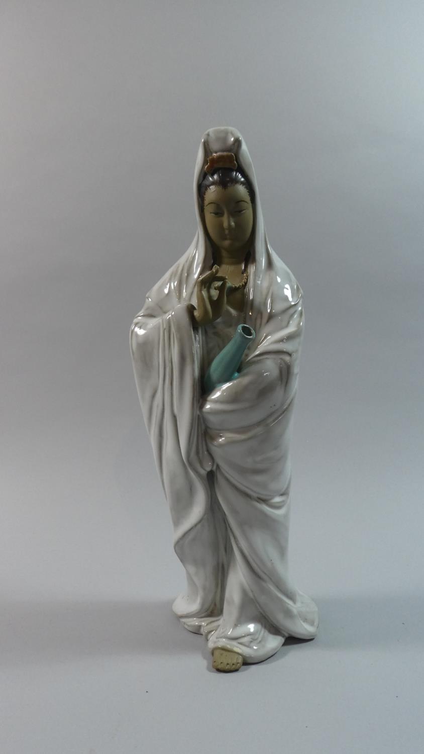 An Oriental Figure, Lady of Mercy, 36cm high