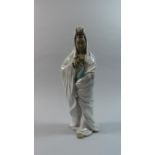 An Oriental Figure, Lady of Mercy, 36cm high