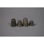 A Collection of Four Silver Thimbles