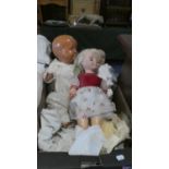 A Collection of Three Vintage Dolls and Dolls Clothes