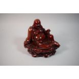 A Resin Study of a Seated Laughing Buddha, 18cm High