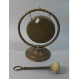 An Edwardian Brass Table Topped Dinner Gong, with Hammer, 27.5cm high