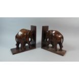 A Pair of Carved African Rosewood Novelty Bookends in the Form of Elephants, Each 22cm high