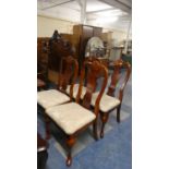 A Set of Four Mahogany Queen Anne Style Dining Chairs with Cabriole Front Legs