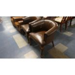 A Pair of Leather Upholstered Tub Armchairs on Cabriole Supports, Some Wear